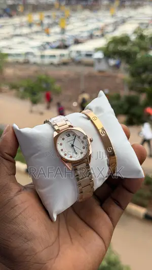 A Rose Gold Tone Cartier Style Watch With a Bracelet