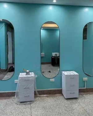 Salon Setup With Curved Mirrors and Drawers