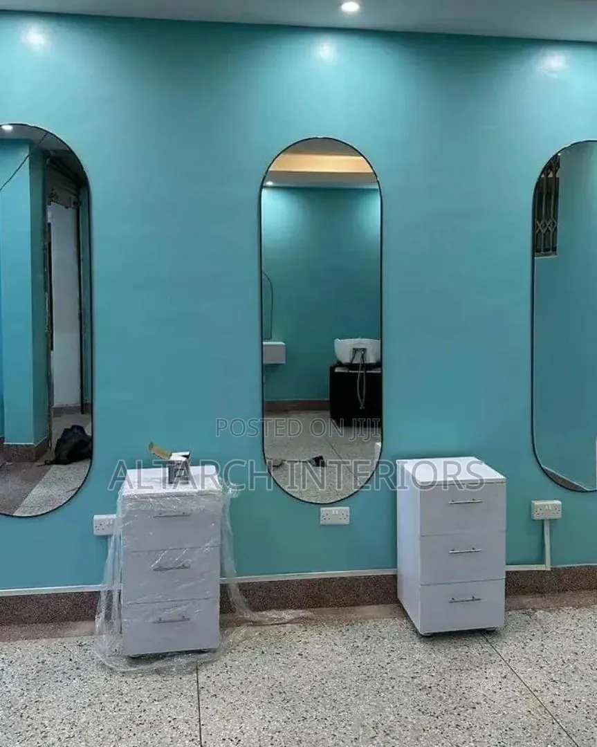 Salon Setup With Curved Mirrors and Drawers