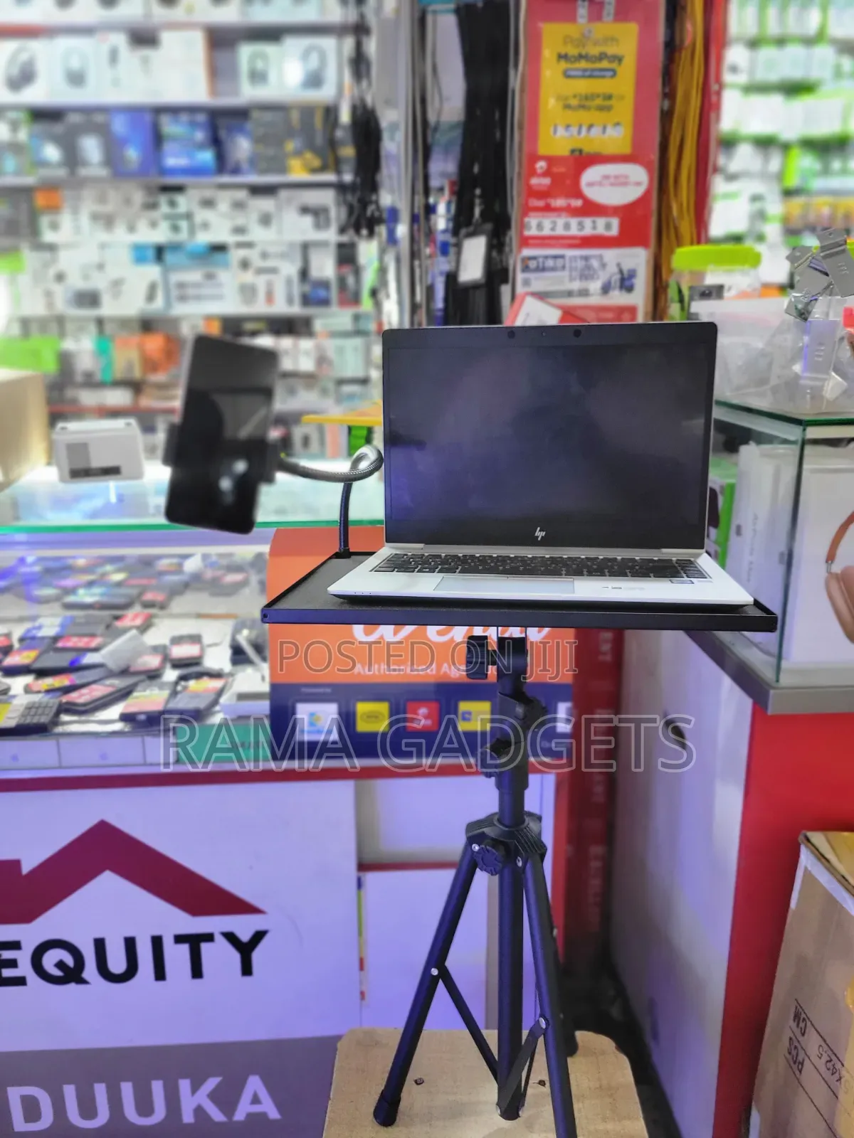 Laptop Stand With an Attached Phone Holder Mounted on a Tripod