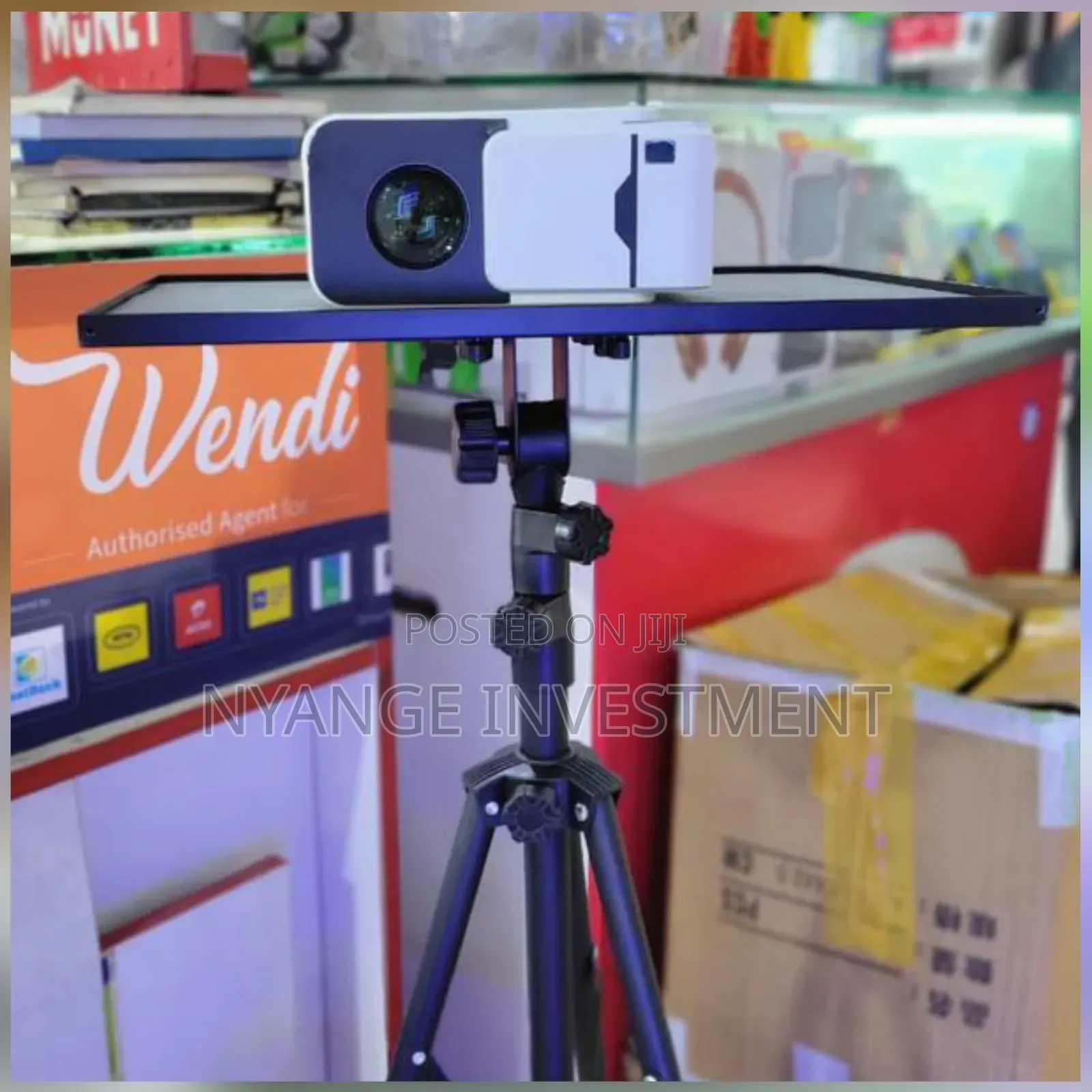 Tripod Projector Stand With a Flat Tray Surface, Likely for Projector.