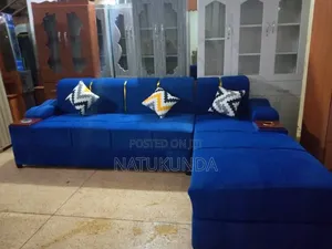 Blue Coach With Cushions and Cup Holders