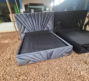 5by6 Gray Stripped Fabric Bed Next to Black