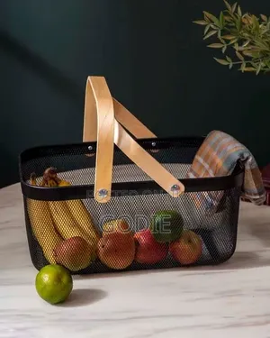 Black Metal Wire Mesh Storage Basket With Light Wood Handles.