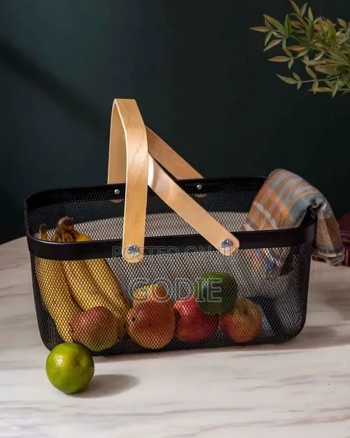 Black Metal Wire Mesh Storage Basket With Light Wood Handles.
