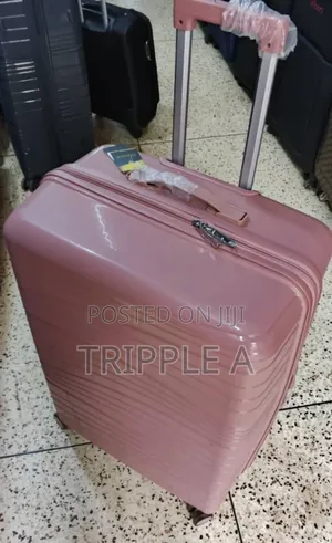 A Medium Pink Pp Rubber Hard Shell Suitcase