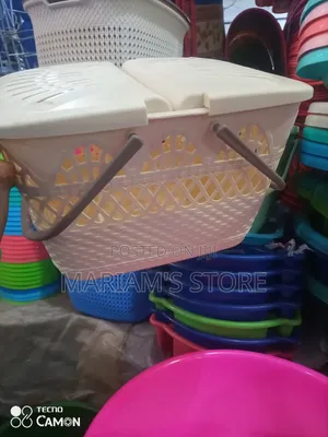 White Plastic Picnic Basket With a Lid and Handles.