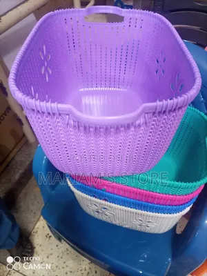 Plastic Laundry Basket With a Woven Pattern.
