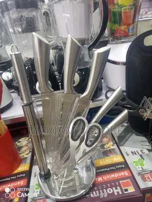 Stainless Steel Knife Set With Acrylic Stand.