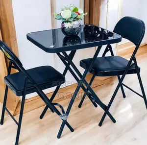 Foldable Glass Table and Two Matching Chairs Set.