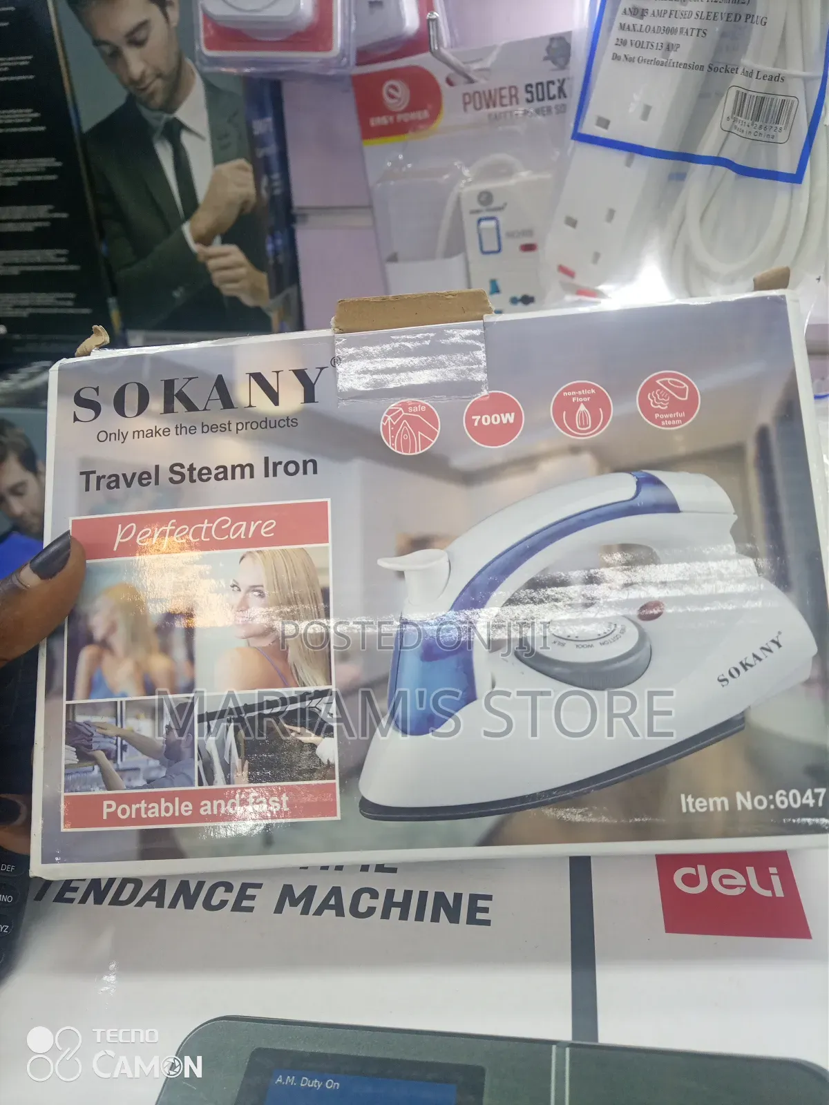 Portable Travel Steam Iron With a Foldable Handle and Blue Accents.