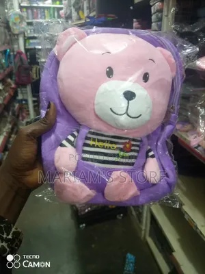 Soft Teddy Bear Backpack With a Purple Plush Exterior. ]