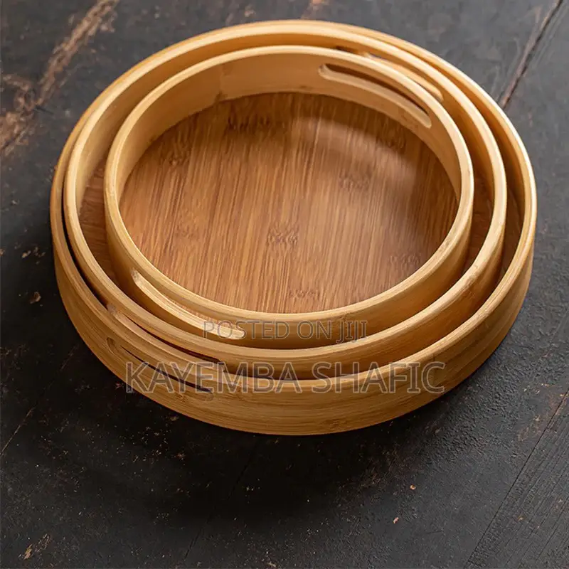 Round Nesting Bamboo Serving Trays With Built-in Handles.