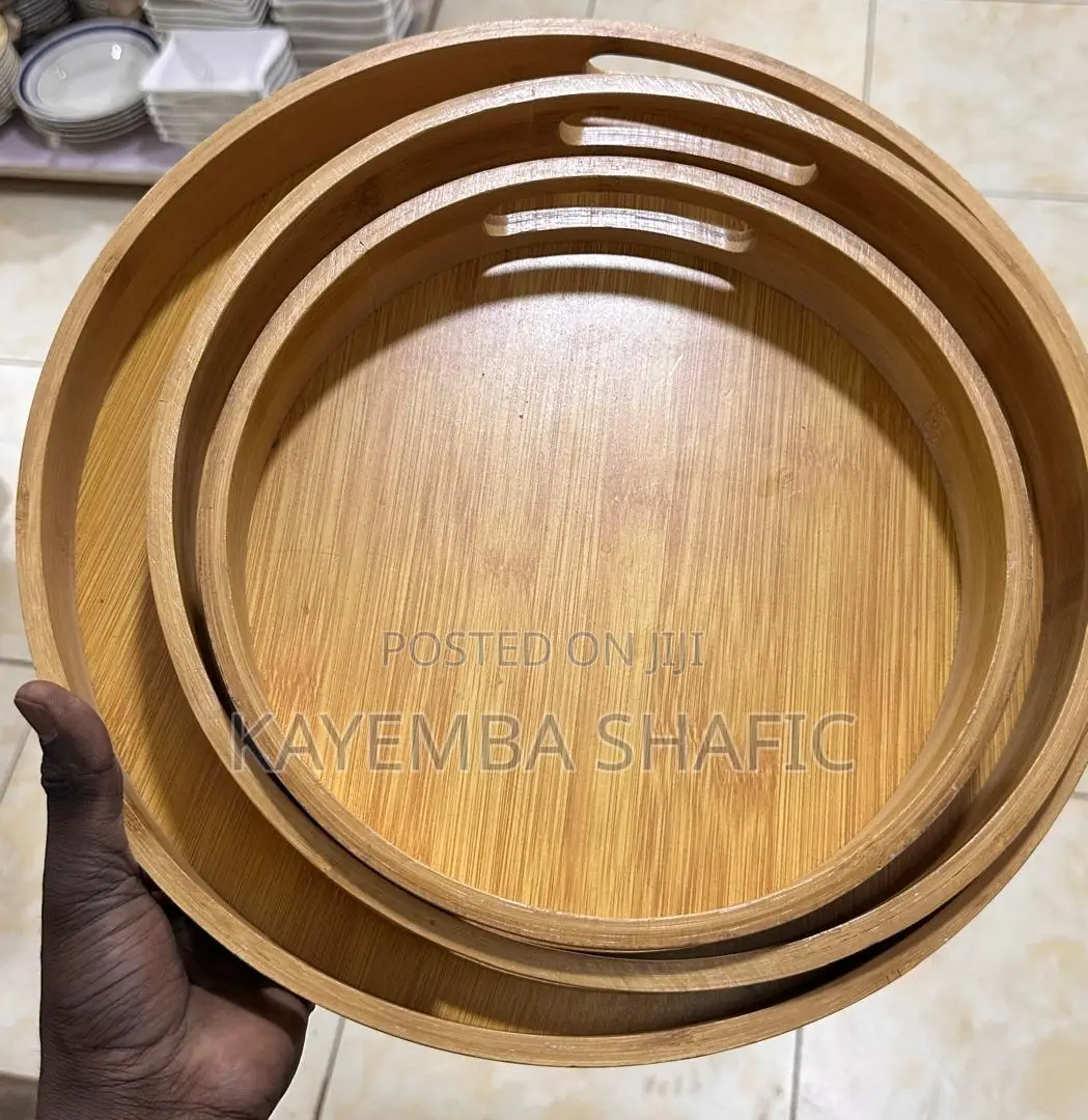 Round Nesting Bamboo Serving Trays With Built-in Handles.