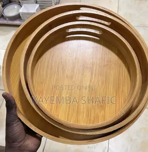 Round Nesting Bamboo Serving Trays With Built-in Handles.