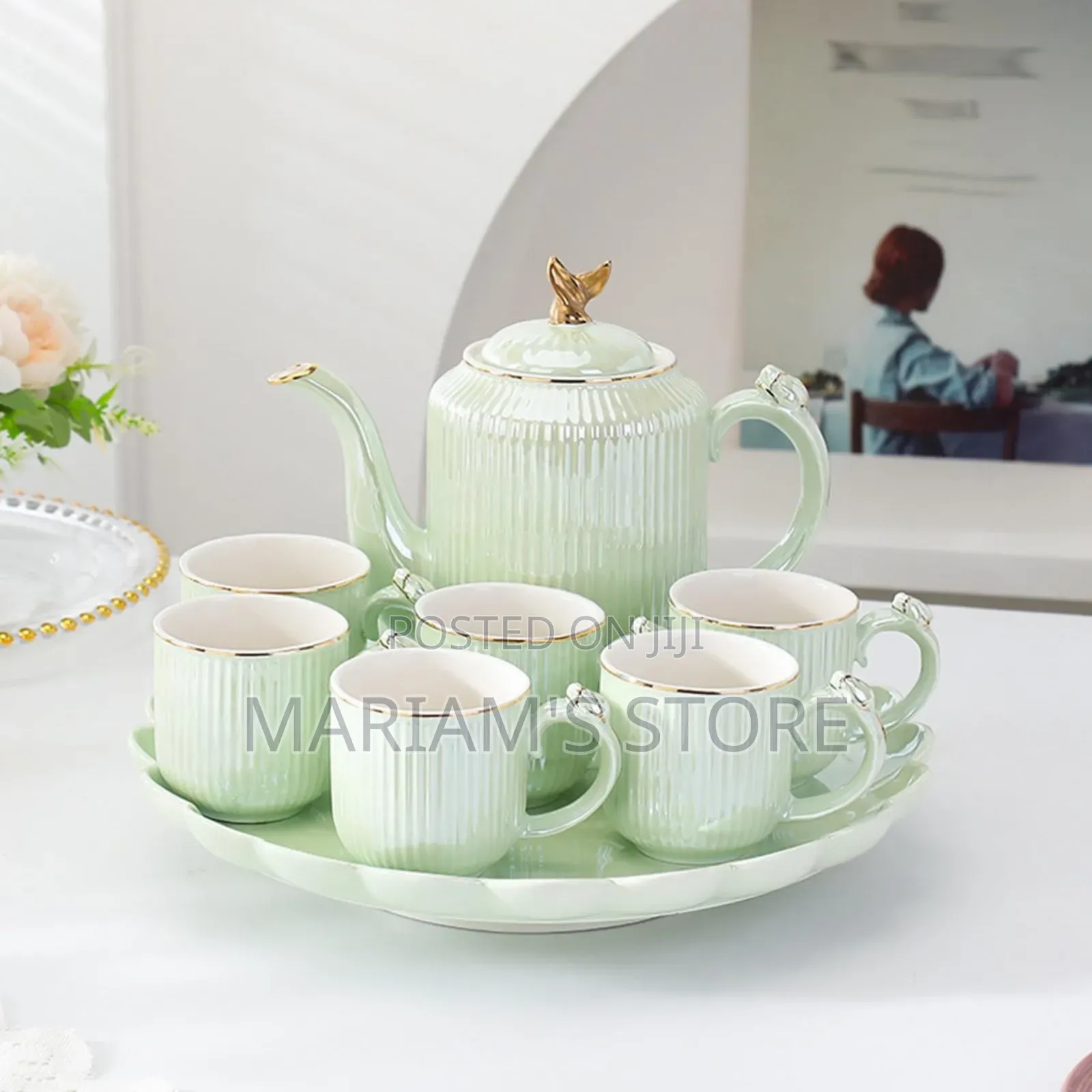 Ceramic Coffee or Tea With a Teacup and Kettle on a Rotating Tray. ]
