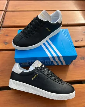 Black Adidas Topanga Sneakers With a White Textured Sole