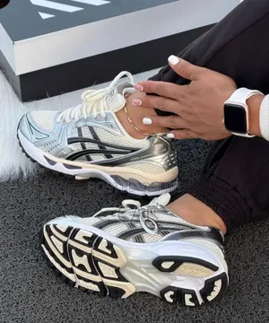 Asics Gel-Kayano 14 Sneakers in a Cream, Black, and Metallic Silver