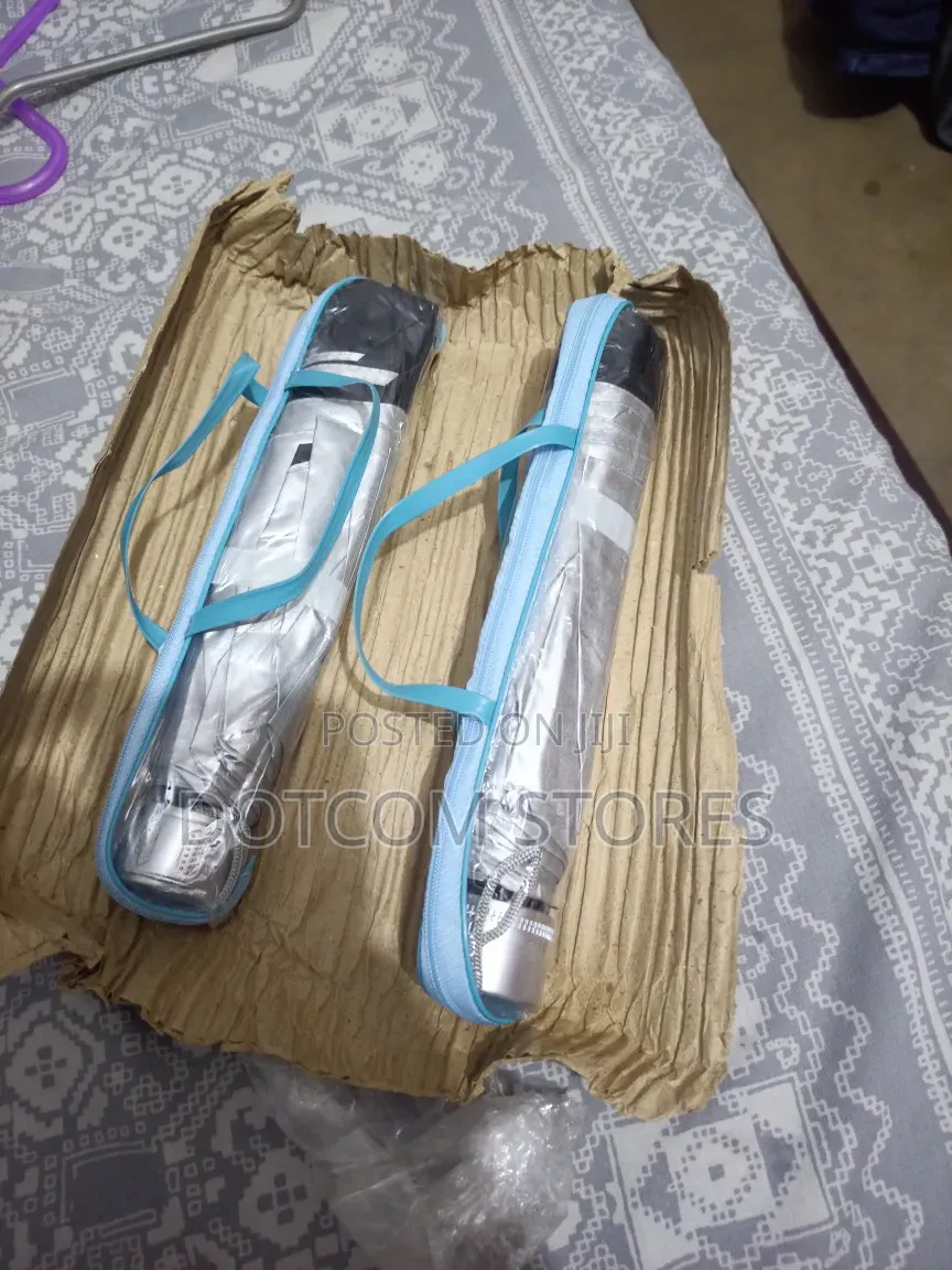 Portable, Foldable Sun And Rain Umbrella.