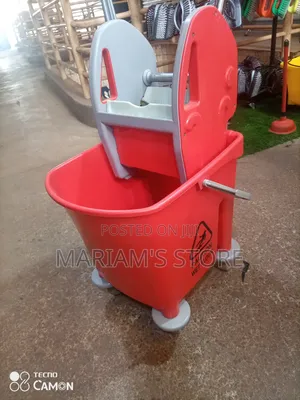 Commercial Red Plastic Mop Bucket With a Built-in Wringer and Wheels