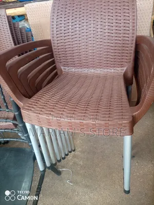 Brown Plastic Armchairs With Metallic Leg]