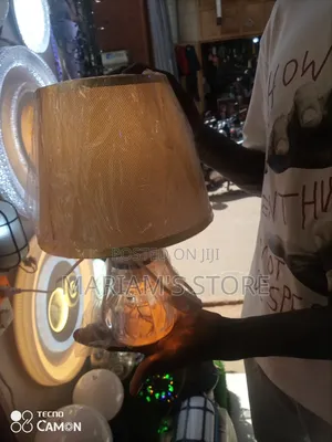 White and Gold Bedside Table Lamp With a Linen Shade.