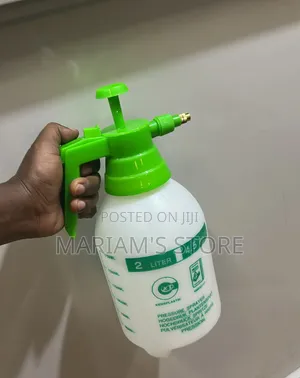 2-Liter Pressure Sprayer With a Green Pump Handle and a White Bottle.