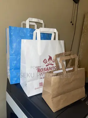 100pcs Paper Bags Branded And In Branded From A4 Size.