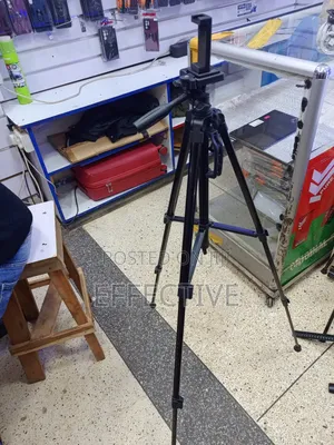 Professional Portable Camera Tripod With a Phone Holder Mount.