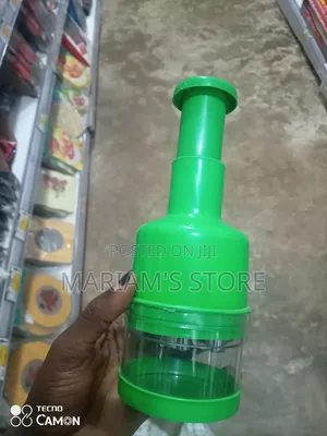 Handheld Manual Garlic and Vegetable Chopper in a Vibrant Green Colo]
