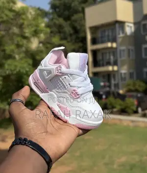 White and Pink Version of Air Jordan 4 Retro Sneakers