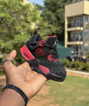 Toddlers Black and Red Colorway Air Jordan 4 Retro Sneakers