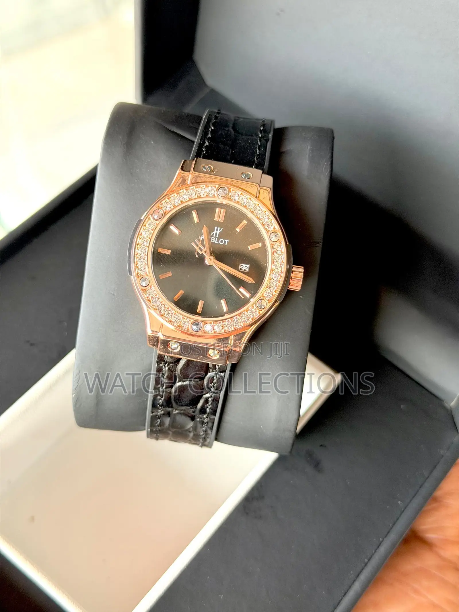 Black Ladys Watch With a Gold Head