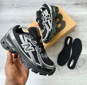 New Balance 740 Sneakers in a Black and Silver Colorway