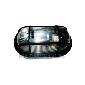 Bulkhead Wall Light a Protective Black Grid Over a Ribbed Glass Cove]