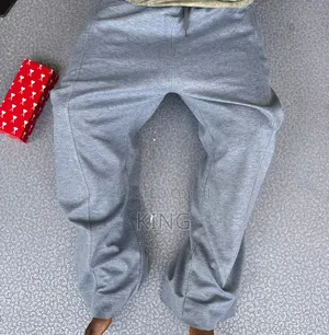 Unisex Open-Hem Buggy Sweaterpants in Grey and Black.