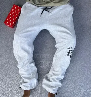 Unisex Open-Hem Buggy Sweaterpants in Grey and Black.