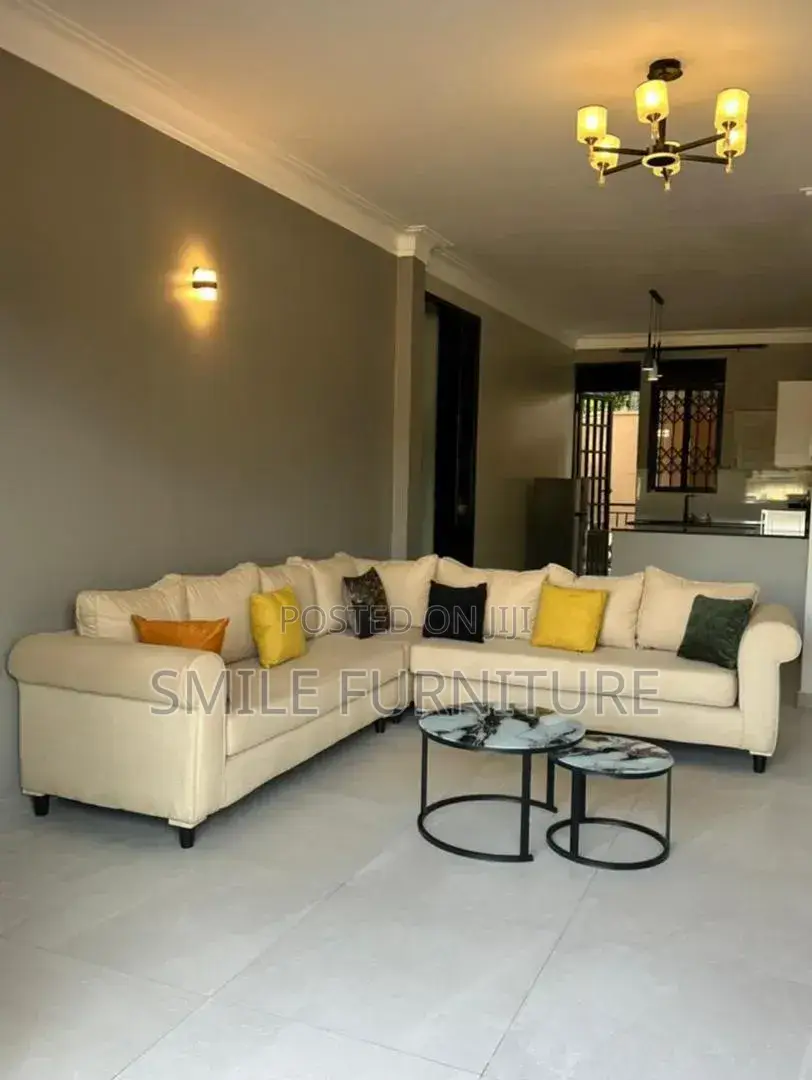Elegant Modern L- Shaped Sectional Sofa With Marble Top Nesting Table.