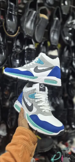 Counterfeit Mid-Top Sneaker Branded as "Kike Sport