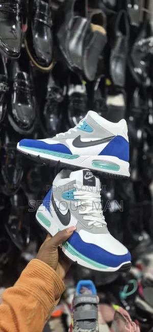 Counterfeit Mid-Top Sneaker Branded as "Kike Sport