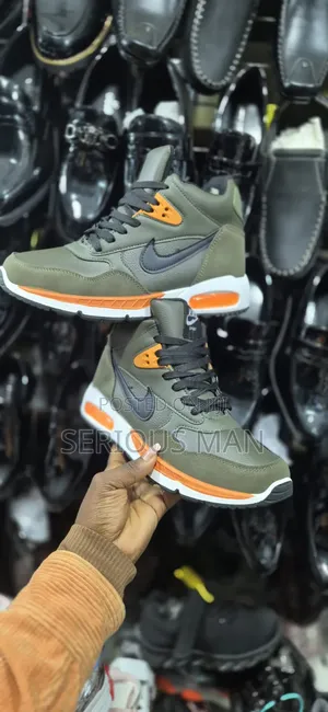 Counterfeit Mid-Top Sneaker Branded as "Kike Sport