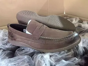 These Appear to Be Brown Clarks Leather Loafers, Featuring a Classic .