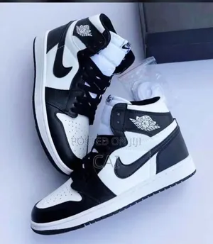 Nike Air Jordan 1 Sneakers in a Black and White "Panda" Style.