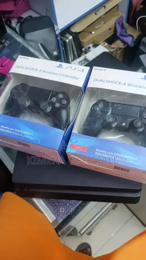 Ps4 Slim With 2 Controller and 12 Games. In Good Condition