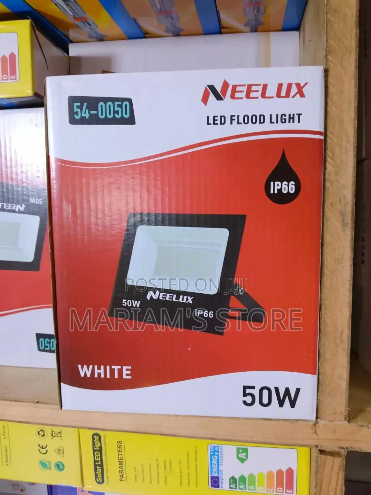Neelux 50w Led Flood Light Packaged in a Red and White Box.