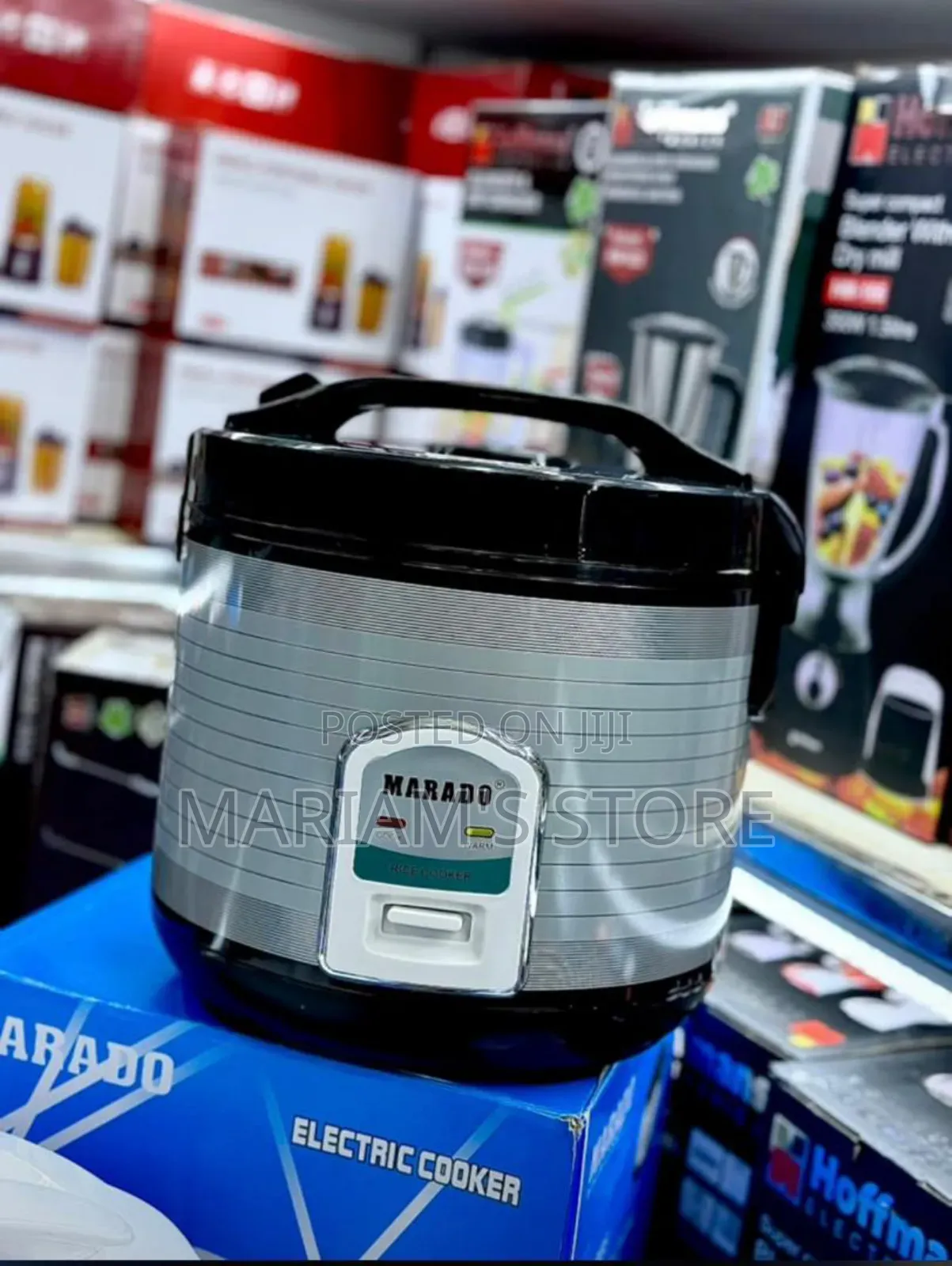 Automatic Electric Rice Cooker With a Silver and Black Design .