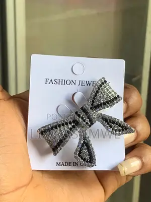 Brand Bow Brooch Features a Distinctive Black and White Rhinestone