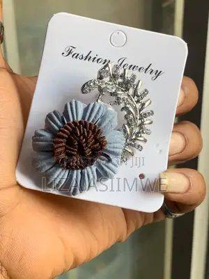 Blue Fabric Flower Brooch With a Brown Center