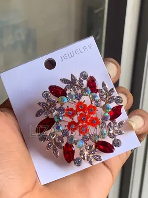 Floral Brooch Featuring a Prominent Center of Red Flowers