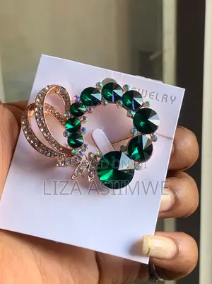 Rosegold Tone Brooch Features Emerald Green and Iridescent Rhinestones
